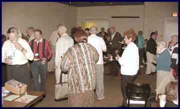 Crowd of people eating pizza